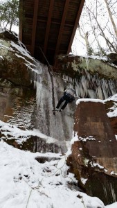 Bryan repelling into Under the Bridge (WI3 10m) in the Keweenaw